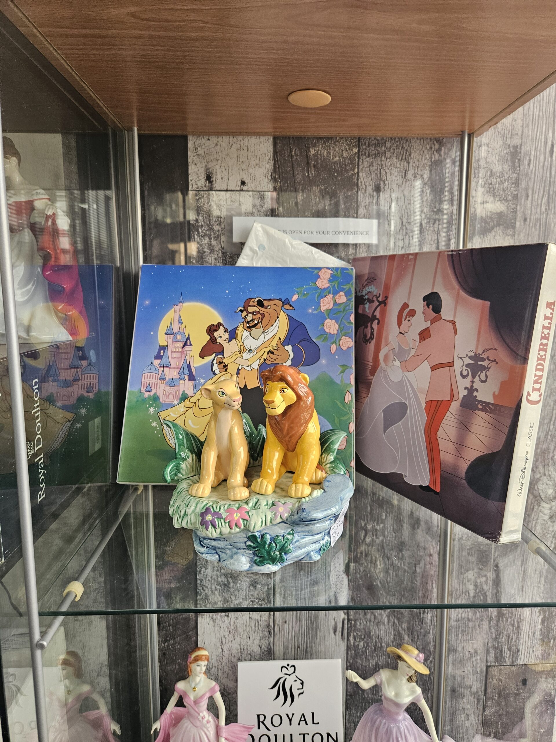 Disney collectible plates and Lion King wind up box